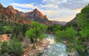 HDR image of the last rays of sun hitting The Watchman with the Virgin River in the foreground in ZIon National Park, Utah