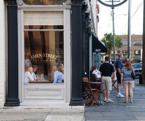 People at Amen Street Fish & Rawbar restaurant on East Bay Street in Charleston, SC