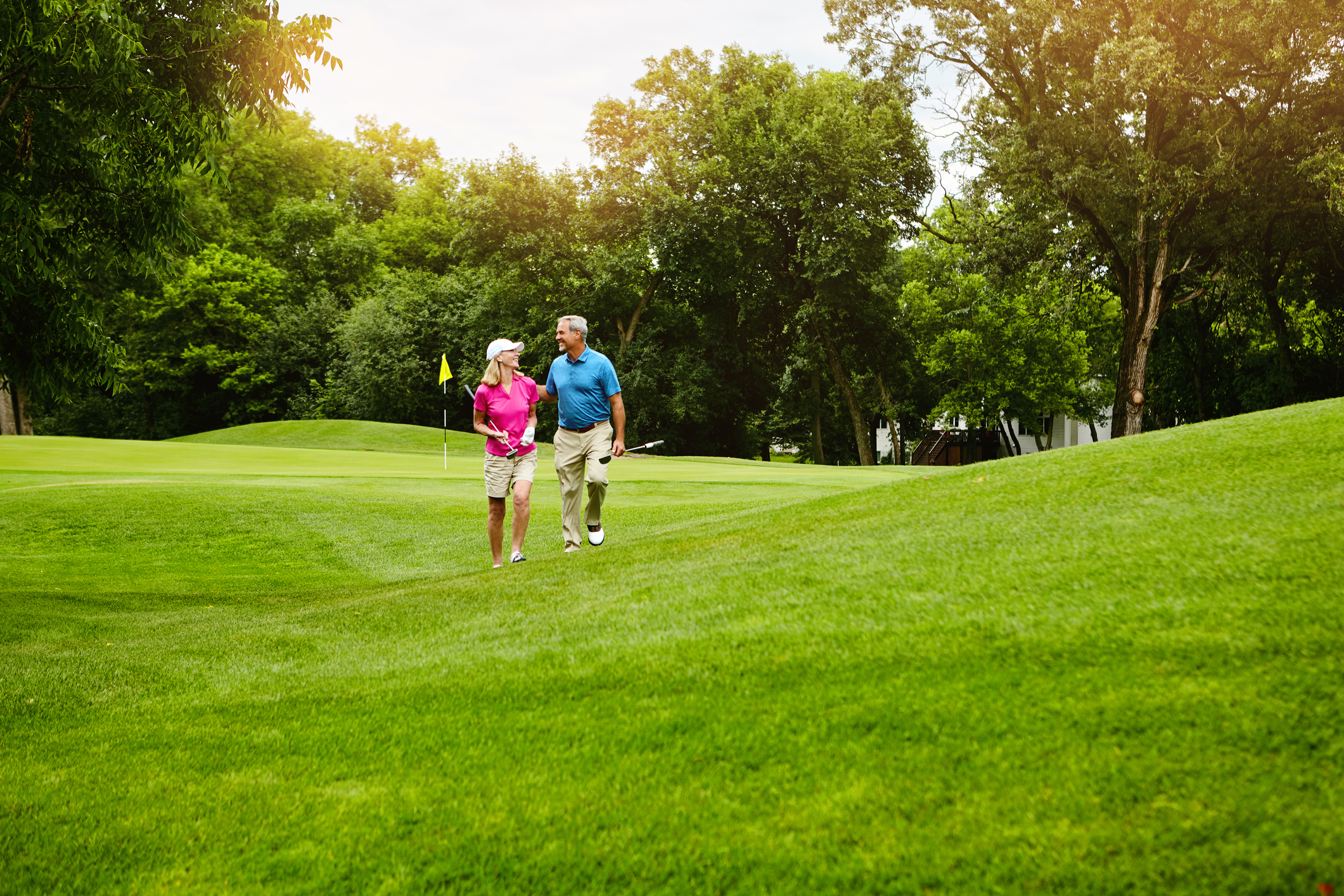 Shot of a mature couple on a golf course